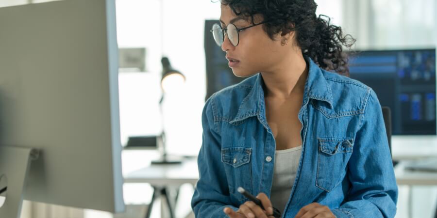 An AI specialist works at their computer