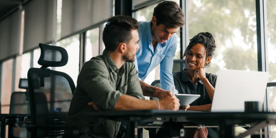 Members of a data governance team review policy documents