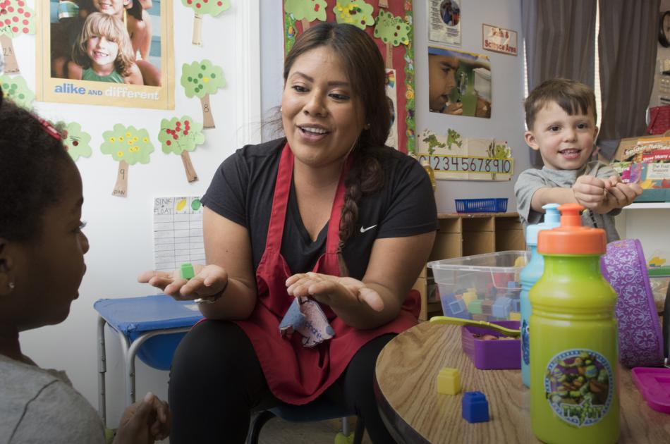 A Culture of Accessibility CSUN teacher playing with 2 pre-school children in class