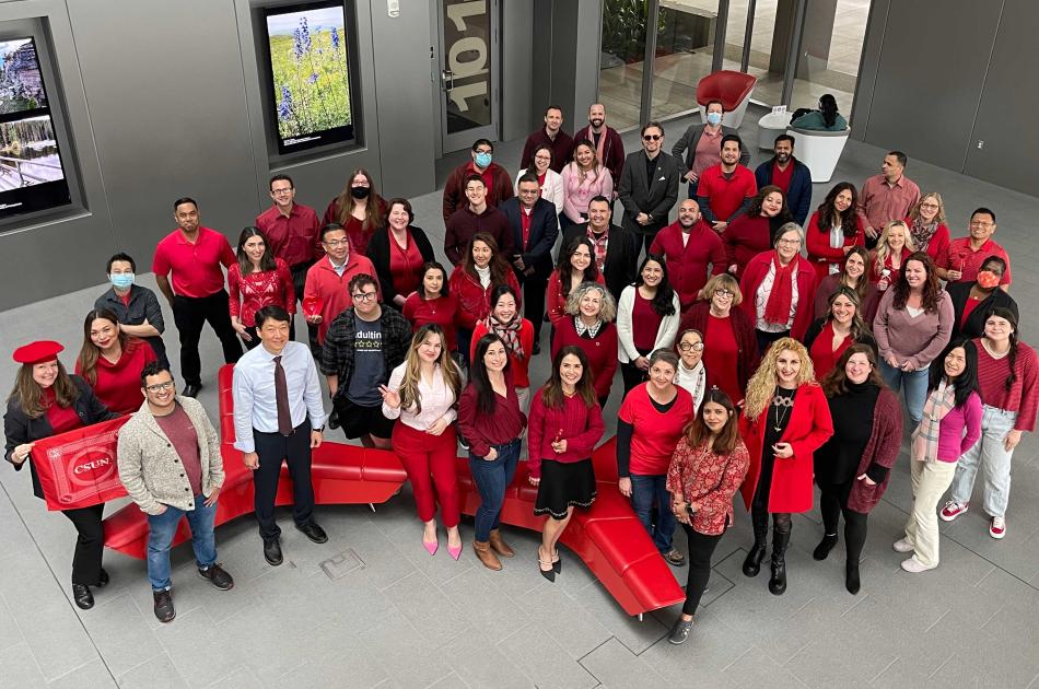 Tseng College staff wearing red standing for Valentines group photo