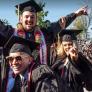 Three smiling CSUN students on their graduation day.