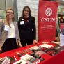 Samantha from Alumni Relations and Sherry from the Tseng College greet visitors to the CSUN table Samantha from Alumni Relations and Sherry from the Tseng College